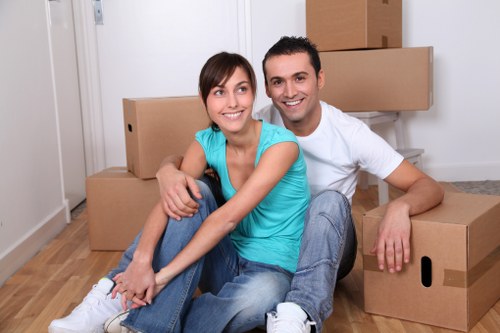 Removal team packing and transporting furniture in Barnsbury