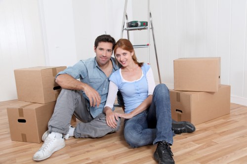 Professional movers navigating stairs in a Barnsbury property